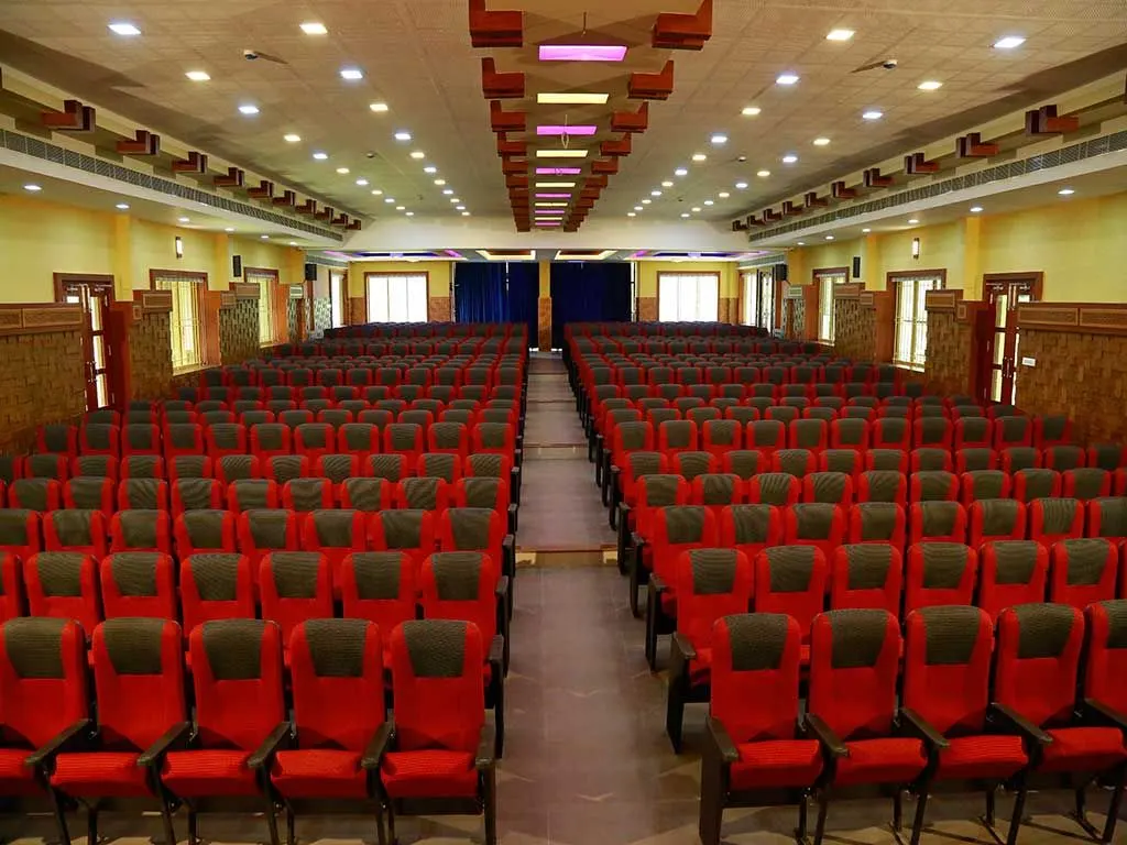 Diamond Castle auditorium with rows of red seats